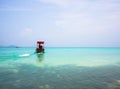 Long-tailed boat heading out to sea Royalty Free Stock Photo