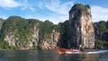 Long Tailed Boat with amazing cliff in the background, Krabi, Thailand