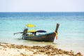 Long tailed boats near tropical beach at Ko Phi Phi, Thailand. Tropic beach with white sand and turquoise water, concept of Royalty Free Stock Photo