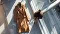 Photorealistic image of a long coat next to a store window Royalty Free Stock Photo