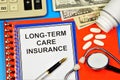 Long-term health insurance. Text label in the planning folder. Royalty Free Stock Photo