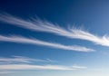 Long, thin cirrus clouds stretch across Royalty Free Stock Photo
