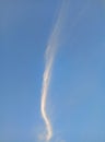 Long thin clouds against the background of a bright blue sky Royalty Free Stock Photo