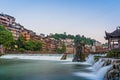 Cascade and Old Mill wheel on the Tuo Jiang river in Feng Huang