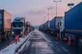 a long traffic jam of many trucks at the border , a long wait for customs checks between States due to the coronavirus