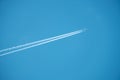Trail of jet plane on blue sky Royalty Free Stock Photo