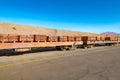 A long train carries stacks of copper cathodes Royalty Free Stock Photo
