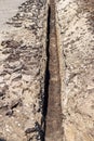 Long trench for laying water supply and sewage system pipes Royalty Free Stock Photo