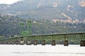 Long truss bridge with an elevating arched section across the Co