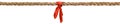 Long tug of war rope pulled tight, with red ribbon tie. Concept of conflict, competition, or rivalry. Royalty Free Stock Photo