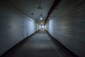 Long underground bunker tunnel leading to the right with illumination Royalty Free Stock Photo