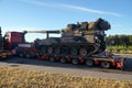 Long vehicle. Over-standard, atypical road transport. A howitzer on the tank chassis. Exceptional convoy Royalty Free Stock Photo