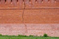Long vertical crack in a red brick wall Royalty Free Stock Photo