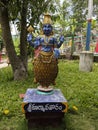 Long vertical view of Kurma avatar idol in Natural arch rock garden in Tirumala