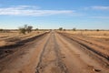 a long view of a desolate walking path at a camp