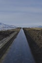 A long view down the cold metal rail