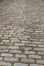 Long view down a gray block street, selective focus