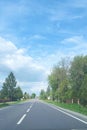 long view of a highway with a storm brewing in the distance