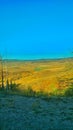 Long view of the valley from a high cliff road in Colorado Royalty Free Stock Photo