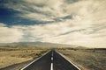 Long way black asphalt road in the middle of the desert. travel and discover lost places concept for wanderlust people. straight