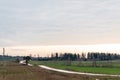 A long way through the fields in autumn