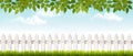 Long white fence banner with grass and fence.