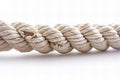 A long white rope with two ends, one end broken off, isolated on a solid background. the cut end of the cable is visible, showing Royalty Free Stock Photo