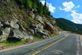 Long and Winding Curvy Mountain Road with Rock Slide Fencing Royalty Free Stock Photo