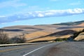 Long and winding road through the rolling hills of Central Oregon Royalty Free Stock Photo