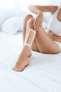 Long Woman Legs With Hair Wax Strip Closeup. Hair Removal Royalty Free Stock Photo