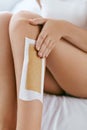 Long Woman Legs With Hair Wax Strip Closeup. Hair Removal Royalty Free Stock Photo