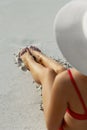 Long Woman Legs With Smooth Soft Skin. Close Up Of Female With Perfect Healthy Silky Legs Skin After Hair Removal On The Beach. Royalty Free Stock Photo