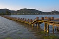 Long wood bridge over a river