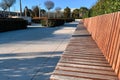 Long Wooden Bench in a Modern Cultural Park in the Summer at Sunset Royalty Free Stock Photo