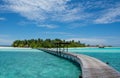 Long wooden bridge to the tropical island at Maldives Royalty Free Stock Photo