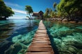 A long wooden dock in the middle of a body of water in exotic island Royalty Free Stock Photo