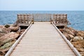 Long Wooden Dock with Observatory and View of the Ocean Royalty Free Stock Photo