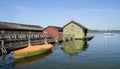 pier and boat houses on lake Ammersee with sailing boats and Alps in background in Bavarian village Schondorf (Germany) Royalty Free Stock Photo