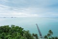 The long wooden pier with light cloud sky after the rain - Intercontinental Samui, Thailand Royalty Free Stock Photo