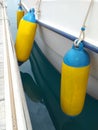 Long yellow Fenders and accessories for boats. Nautical concept