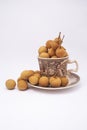 Longan fruit in mug on white background.  In Indonesia it is commonly called Kelengkeng Royalty Free Stock Photo