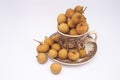 Longan fruit in mug on white background.  In Indonesia it is commonly called Kelengkeng Royalty Free Stock Photo