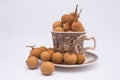 Longan fruit in mug on white background.  In Indonesia it is commonly called Kelengkeng Royalty Free Stock Photo
