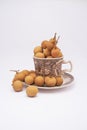 Longan fruit in mug on white background.  In Indonesia it is commonly called Kelengkeng Royalty Free Stock Photo