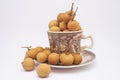 Longan fruit in mug on white background.  In Indonesia it is commonly called Kelengkeng Royalty Free Stock Photo