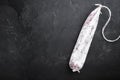 Longaniza dry cured sausage on black background with space for text