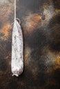 Longaniza sausage on dark background, top view with copy space