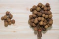 Longans fruits grown in tropical with wooden background part 4