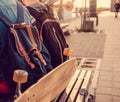 Longboard and backpack on a bench. Royalty Free Stock Photo