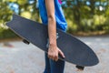 A longboard in the hand of a child Royalty Free Stock Photo